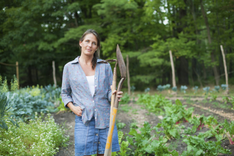 a woman working in an organic garden